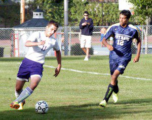 Westfield Voc-Tech's Dmitriy Stepanchuk (11) dribbles the ball as Jonathan Garcia (12) looks on for Putnam Monday at Jachym Field. (Photo by Chris Putz)