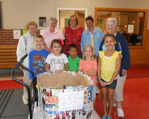 The Resident Council of Armbrook Village chose to donate school supplies to Southampton Road Elementary School as part of our "Giving Back" series. Pictured are Principal Kathleen O'Donnell with some of her first grade students and Armbrook Village residents Sally Stuck, Marie Jordan, Dee Mercure and Barbara Sheldon. For more information on Armbrook Village Senior Living, please call 568-0000. 