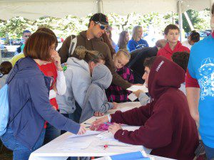 Team members register as they arrive at Stanley Park Sept. 28 for the 11th annual Western New England Walk Now For Autism Speaks. (Photo by Hope E. Tremblay(