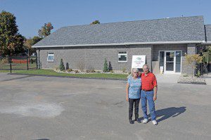 Robert and Barbara Polverari, of Southwick, stand in front of the new Polverari / Southwick Animal Control Facility. The couple donated the $300,000 structure to the Town of Southwick earlier this year. (Photo by Frederick Gore)