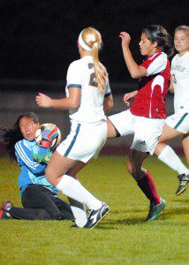 Westfield's  Beka Santiago, center right, slams a point-blank kick into Northampton goalkeeper Rose Katz-Berger during Monday night's game. (Photo by Frederick Gore)