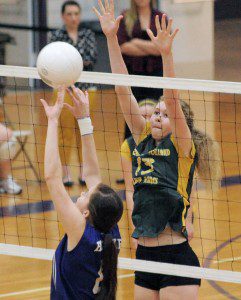 Southwick's Hannah Sitler, right, sets for the block during Thursday night's game against Holyoke. (Photo by Frederick Gore)