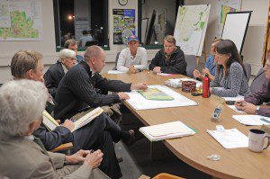 Robert Levesque, principle of R, Levesque Associates in Westfield, left center, explains a site plan of the Hampden Care Facility located at 27 Hudson Drive in Southwick as a group of attorneys, left, listen during Tuesday night's meeting with the Southwick Planning Board. (Photo by Frederick Gore)