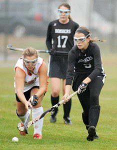 Westfield senior forward Lexi Minicucci, right, and Agawam senior defender Ashley Lockwood go stick-to-stick during Thursday's game in Agawam. (Photo by Frederick Gore)