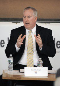 Westfield Mayor Daniel M. Knapik reacts to a question during last night's Mayoral Candidate Forum at Westfield Vocational-Technical High School with Michael L. Roeder. (Photo by Frederick Gore) 