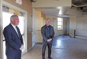 Peter Pappas, center, owner of the new restaurant at Barnes Regional Airport, joins Westfield Mayor Daniel Knapik, left, in October at the site.  (File photo by Frederick Gore)
