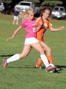 Westfield's  Annie Brozini, foreground, battles Agawam forward Elyse Cote during Monday's girls' soccer game in Westfield. (Photo by Frederick Gore)