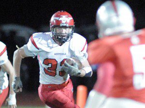 Westfield's Noah Swords carries the ball during the first quarter against East Longmeadow Friday night. (Photo by Frederick Gore)