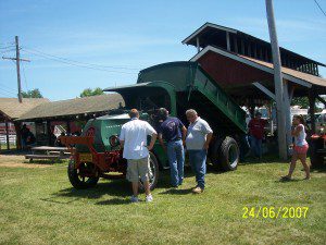 Spectators look over a dump truck at an American Truck Historical Society show. The Pioneer Valley Chapter will host a show in Westfield Oct. 13. (Photo by Nancy Prifti)