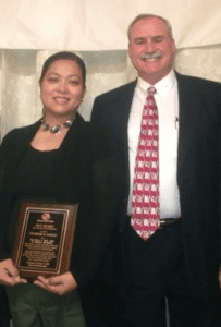 Charisse Angco receives her Most Valuable Professional Award from Bill Parks, executive director for the Boys & Girls Club of Greater Westfield. (Photo submitted)