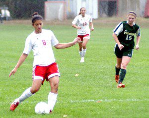 Westfield's Beka Santiago (8) winds up to kick as players look on. (Photo by Chris Putz)