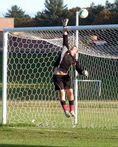 Southwick goalie Patrick King tips a shot up and over the crossbar for one of several saves against visiting Monson Tuesday. (Photo by Chris Putz)