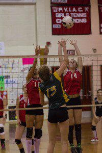 Westfield's Chiara Manfredi and Emily Andrews attempt a block against Southwick. (Photo by Noah Buchanan)