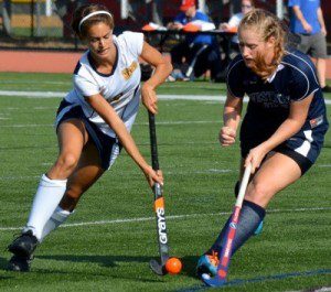 Westfield's Kelsey Carpenter applies heavy defensive pressure to Southern Maine's Peyton Dostie. (Photo by Mickey Curtis)