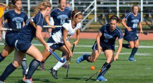 The Westfield defense, including Kelsey Carpenter (left) and Courtney Araujo (right) was able to contain Peyton Dostie in the first half, but the Southern Maine standout erupted for four second-half goals to rally the Huskies to a 5-2 victory. (Photo by Mickey Curtis)