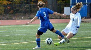 Westfield defender Ali Blanchette beats Worcester State's Alicia Macomber to the ball. (Photo by Nancy Bals)