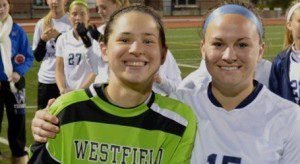 Jess Habif, left, and Lauren Marshall flash their senior smiles during Westfield State's Senior Night ceremony.