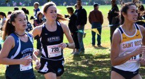 Olivia Marshall, left, crosses the finish line first for Westfield State. (Photo by Mickey Curtis)