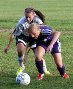 The Saints and Tigers battled in high school girls' soccer action Tuesday. (Photo by Chris Putz)