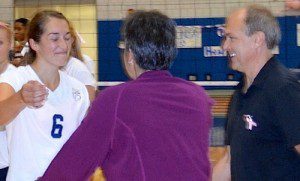Julia Warner is congratulated by her parents after recording her 1,000th career kill. (Photo by Mickey Curtis)