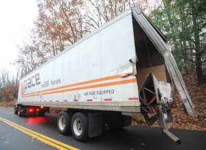 The damage to a tractor trailer rig which was involved in a crash with a school bus Thursday afternoon on Springdale Road appears to be limited to the end of the trailer. (Photo by Carl E. Hartdegen)