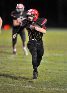 Westfield senior quarterback Jake Toomey takes off running with the ball against East Longmeadow. (File photo by Frederick Gore)