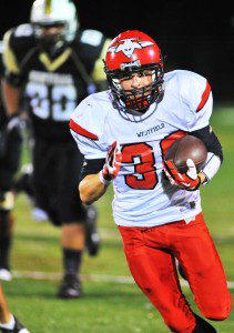 Westfield's Cody Neidig carries the ball against Central. (File photo by Frederick Gore)