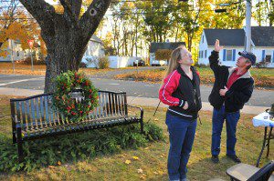 James Lusher, right, explains how is son "Jamie" looks down from the heavens during a memorial ceremony at the Sgt. John Hussey Memorial Park at the intersection of North Elm Street and Holyoke Road as his daughter Jennifer, center, listens. A memorial bench was placed in the park to honor his son who went missing on November 6, 1992. The park was chosen due to it's close proximity to the Lusher home. (File photo by Frederick Gore)