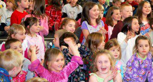 Students at Littleville Elementary School taking part in the pajama count in 2011, as they realize they have collected over 250 sets of pajamas! (File photo)