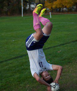 Tigers' Dmitry Stepanchuk goes head over heels for a throw-in Friday. (Photo by Noah Buchanan)