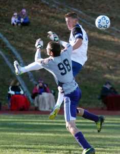Westfield Voc-Tech goalie Vitaly Covileac goes airborne against a Monson player for one of several saves in Monday's Western Massachusetts Division IV tournament game. (Photo by Chris Putz)