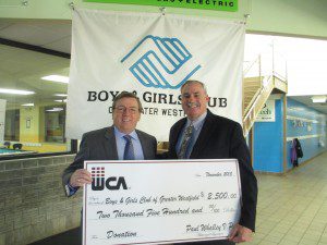 Paul Whalley (left) V.P. of Whalley Computers Associates presents Bill Parks (right), Executive Director of the Boys & Girls Club of Greater Westfield with a $2,500.00 donation as part of their annual support of the Club and its 1,800 youth members. (Photo submitted)