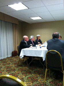 Westfield State University Board Chairman John Flynn III, Finance Committee Chairman Kevin Queenin, and University President Dr. Elizabeth Preston (Left to Right) listen to discussion on policy at Thursday evening's Finance Committee meeting (Photo by Peter Francis)