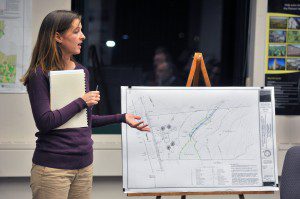 Kate Bednaz, a registered soil scientist and permitting specialist, for R. Levesque Associates Inc., explains a site plan drawing for a new 9,100-square-foot retail store that would be located at 662 College Highway during a meeting with the Southwick Conservation Commission last night at the Southwick Town Hall. (Photo by Frederick Gore)