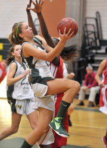 Southwick forward Morgan Harriman goes for the shot as a Commerce defender attempts the block. (Photo by Frederick Gore)