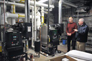 Westfield Mayor Daniel Knapik, right, and Westfield city hall maintenance employee Tom Curran discuss the new energy-efficient natural gas boilers that will heat Westfield City Hall. The new HydroTherm units are manufactured by a division of Mestek Corp. in Westfield and are designed to produce 1,000,000 Btuh each when operating independently. (Photo by Frederick Gore)