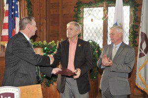 Bob McKean, managing director of Stanley Park, center, accepts a $10,400 Recreational Trails Program (RTP) grant from Department of Conservation and Recreation Commissioner Jack Murray, left, and Richard Sullivan Jr., right, Massachusetts Energy and Environmental Affairs secretary, during a brief ceremony at the Old Meeting House at Stanley Park yesterday. (Photo by Frederick Gore)