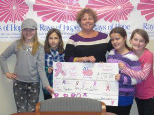 4th grader students- Emma Petzold of Littleville Elementary, Gina Mulvena of Saint Mary's Elementary, Angela Bongiovanni of Papermill Elementary and Sydne Twarosch of Littleville Elementary made and sold pink and white rubber band bracelets for the Rays of Hope Foundation. They raised $252 and presented their "check" to Michelle Garcie on November 22. (Photo submitted)