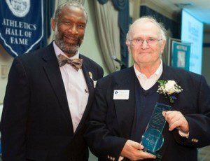 Dr. Karl Leiker, right, receives the James C. Hagan Award from Dr. Carlton Pickron, vice-president of student affairs. (Photo courtesy of Westfield State Sports)