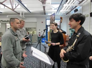 Major Matthew Mutti expresses the unit’s gratitude to singer Alaina Mueller, 15, and Saxophonist, David Jardim, 17. (Photo submitted)  