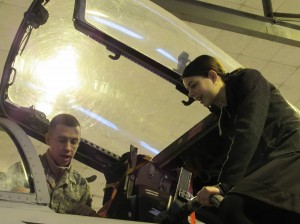 Singer Alaina Mueller has a look inside the cockpit of an F-15 Eagle. (Photo submitted) 