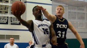 Carl Stewart eludes a defender on a drive to the basket. (Photo by Mickey Curtis)