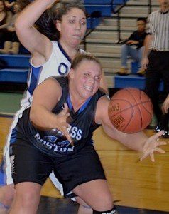 Kirsten Morrison - UMass Boston's 6-2 center - latches on to a loose ball while being closely guarded by Gabby Felix. (Photo by Mickey Curtis)