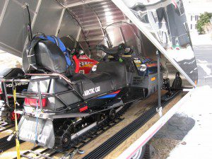 Two gleaming snow machines can be seen inside a trailer which was stolen early Monday morning from a Whitaker Road address. The trailer was subsequently found abandoned in Connecticut but the snowmobiles have not been recovered. 