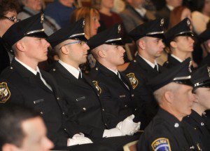 Officers Timothy Fanion, Jeffrey Vigneault, Brendan Irujo, William Cavanaugh and Melissa Burns pay rapt attention to the proceedings at their graduation exercises from the Western Massachusetts Municipal Training Academy Friday morning. (Photo by Carl E. Hartdegen)
