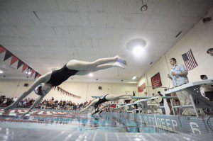 Westfield senior Shaylyn Jurczyk, right foreground, leaves the starting platform during the Girls' 200 Freestyle during Friday night's meet with visiting East Longmeadow. (Photo by Frederick Gore)