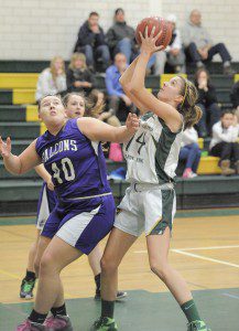 Southwick forward Morgan Harriman, right, goes up for a shot against Smith Academy in a 2013-14 regular season contest. Harriman led the way in this season's game Tuesday night in Hatfield. (Photo by Frederick Gore)