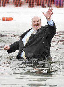 State Sen. Donald Humason Jr. waves to the crowd during Saturday's Penguin Plunge at Hampton Ponds. Humason has participated in every Penguin Plunge fundraiser since it's inception 10-years ago. Proceeds of the event will benefit the Amelia Park Children's Museum. (Photo by Frederick Gore)
