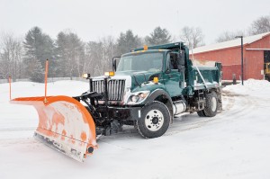 A snowplow operator leaves the former Southwick Department of Public Works yard after refilling his vehicle with salt and sand in preparation of Thursday night's snowfall. (Photo by Frederick Gore)