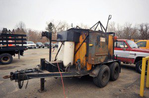 An asphalt hot box machine sits in the rear of the Westfield Department of Public Works. (Photo by Frederick Gore) 